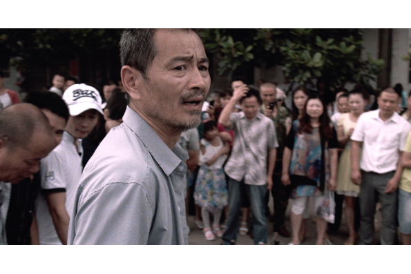 Chen Gang as taxi driver Lao Shi in OLD STONE, a film by Johnny Ma. A Zeitgeist Films release.