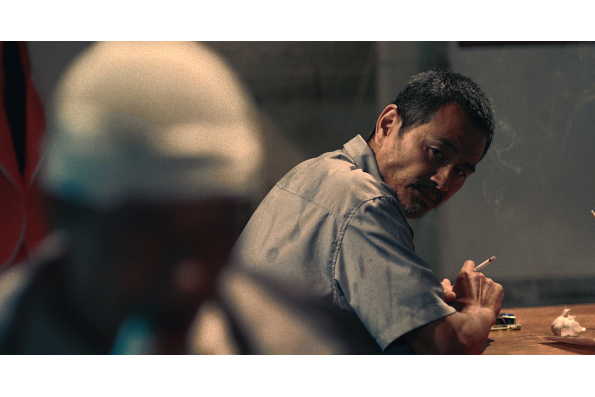 Chen Gang as taxi driver Lao Shi in OLD STONE, a film by Johnny Ma. A Zeitgeist Films release.